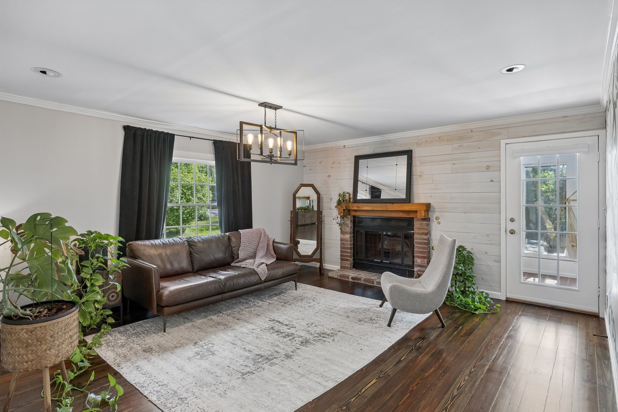 Living room with hardwood floors and a fireplace at 1307 Old Hickory Boulevard, Brentwood TN