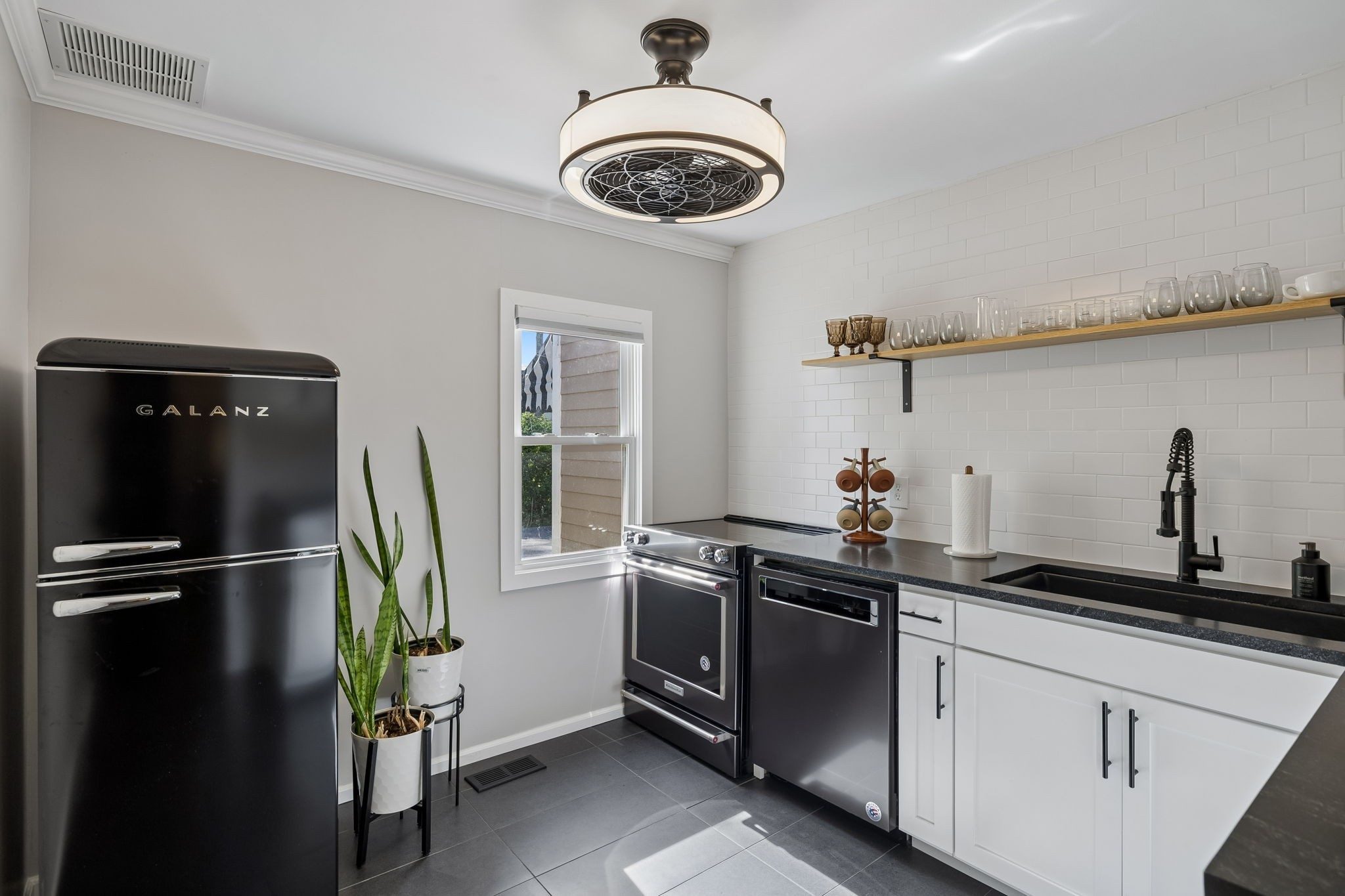 Kitchen with open shelves and stainless appliances at 1307 Old Hickory Boulevard, Brentwood TN