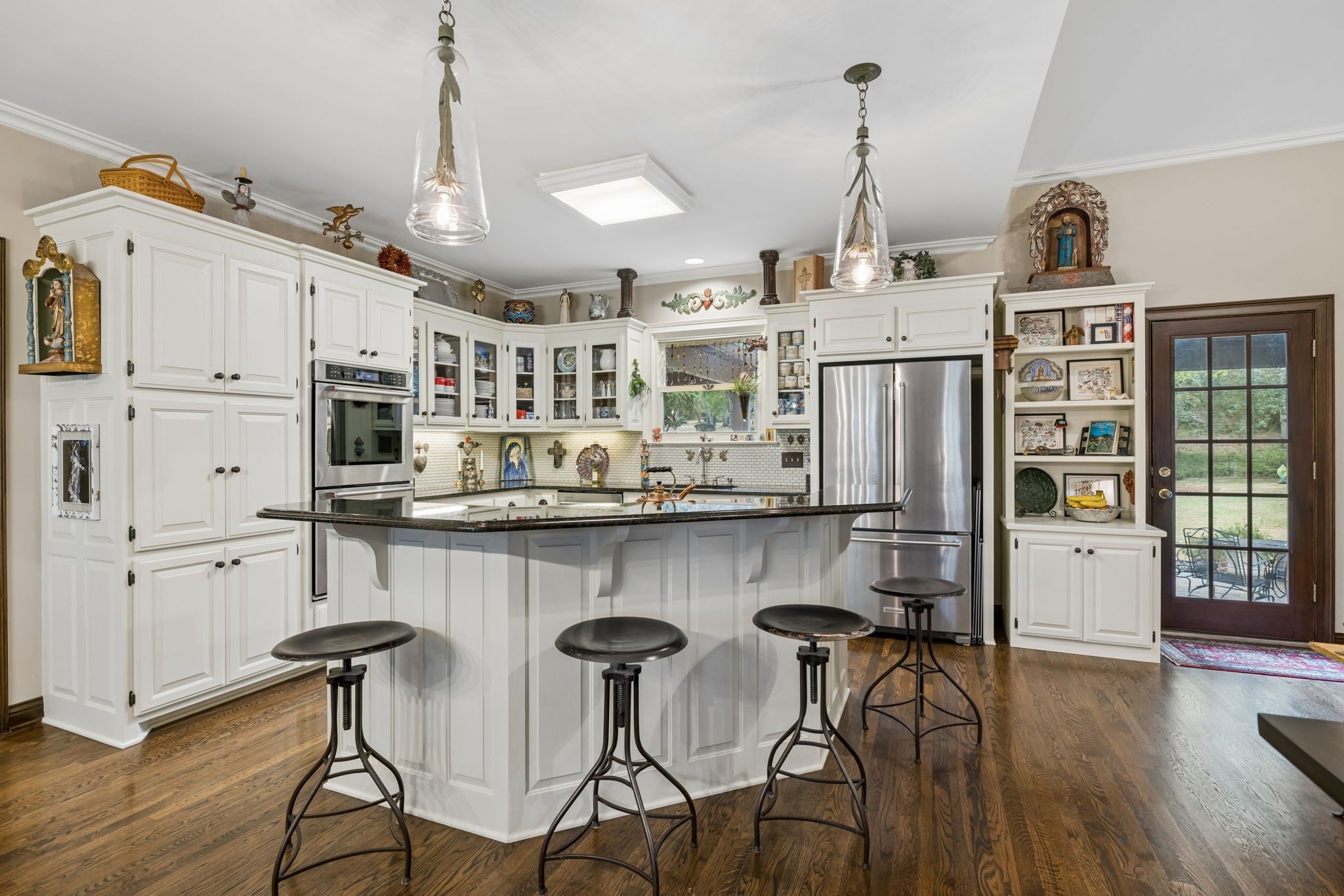 Kitchen with white cabinets and a large island at 1514 Knox Valley Drive, Brentwood TN