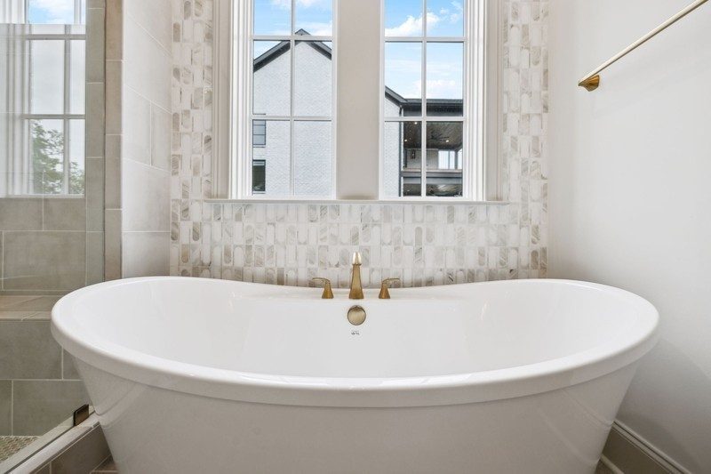 Representative photo: primary bath with a freestanding tub in an Elmsley plan home, not 1817 Dartmouth Drive, Brentwood TN