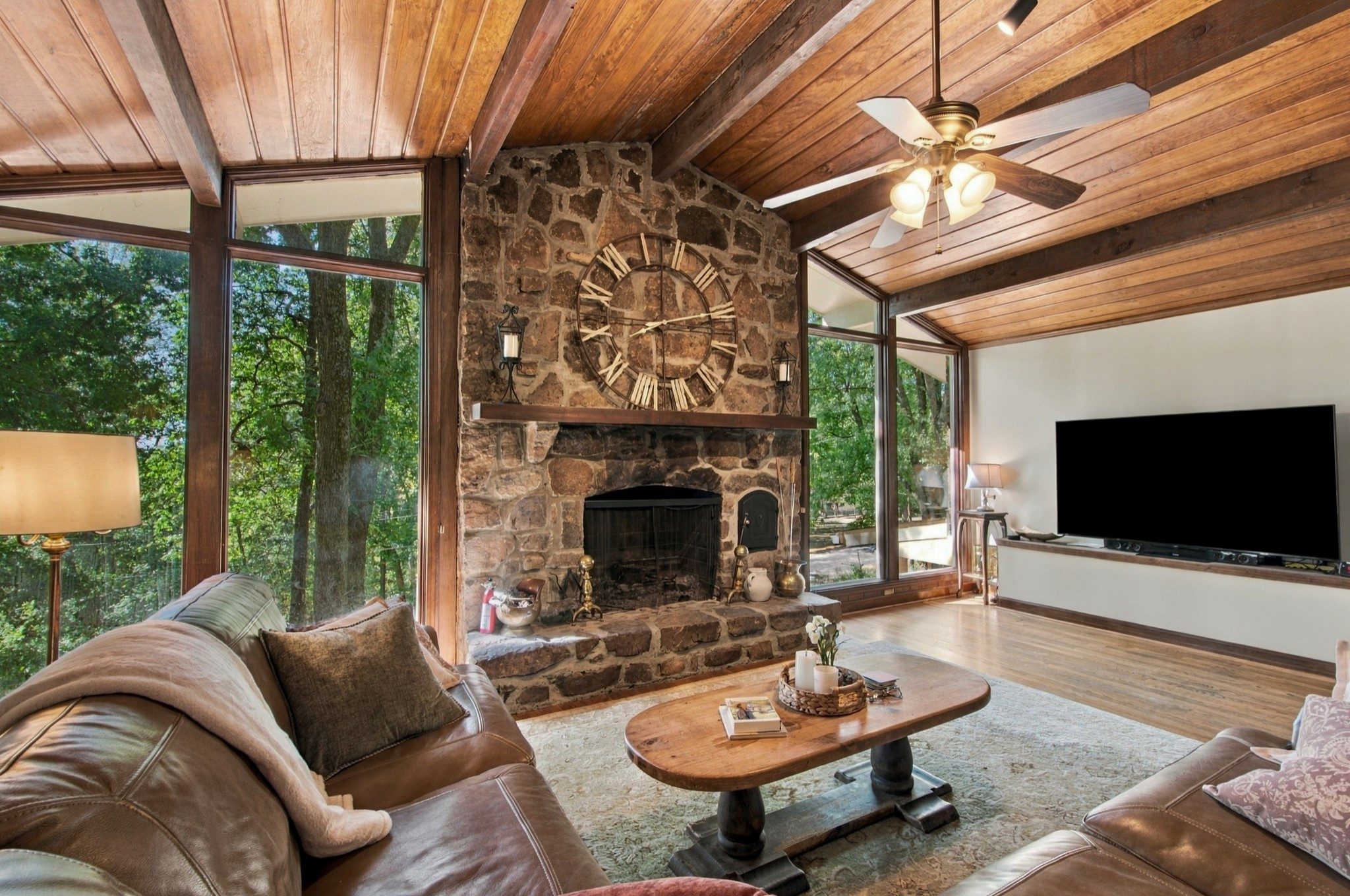 Den with a stone fireplace and wood ceiling at 5312 Lancelot Road, Brentwood TN