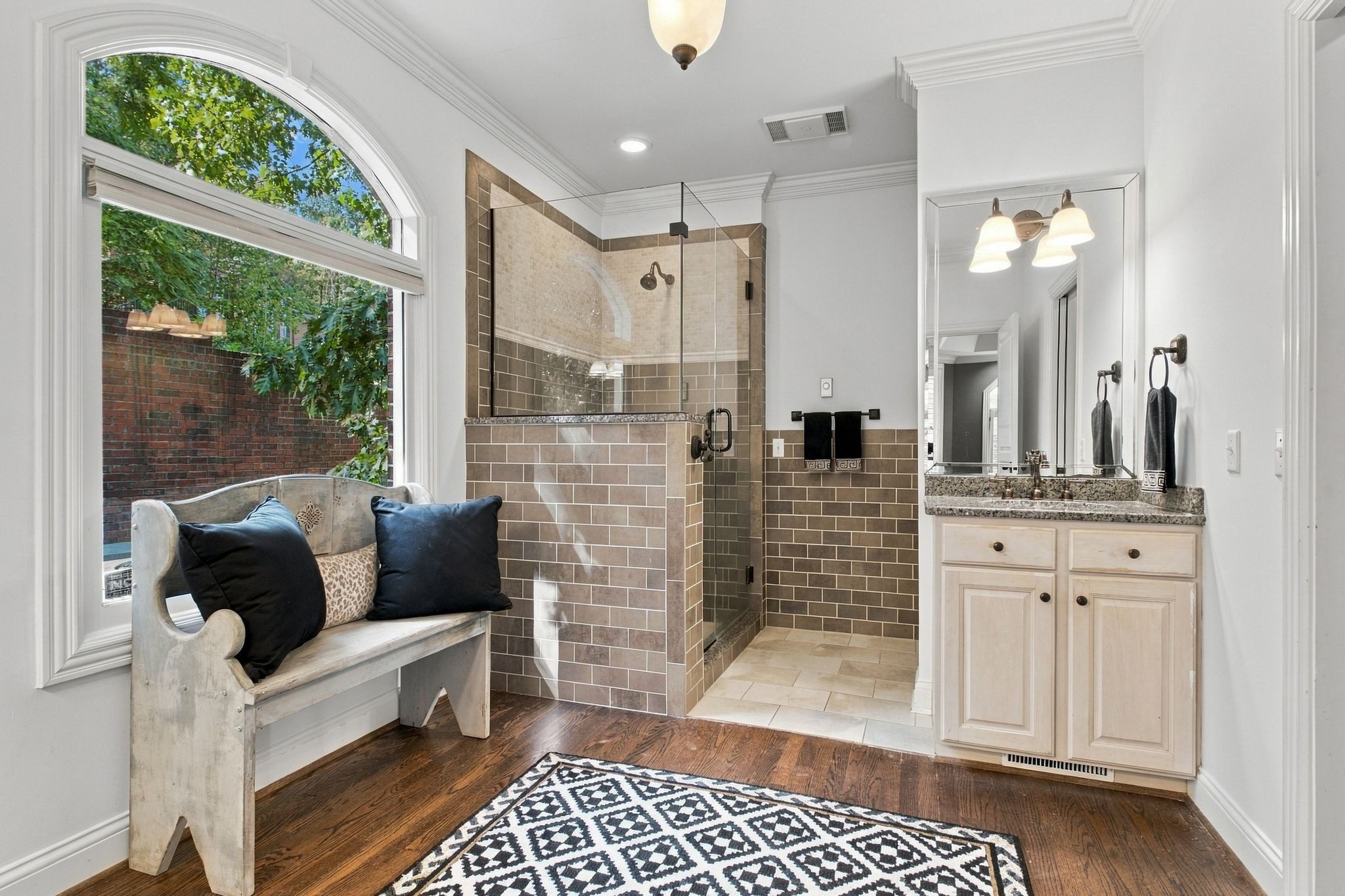 Primary bath sitting area with an arched window at 710 Ashley Run, Brentwood TN