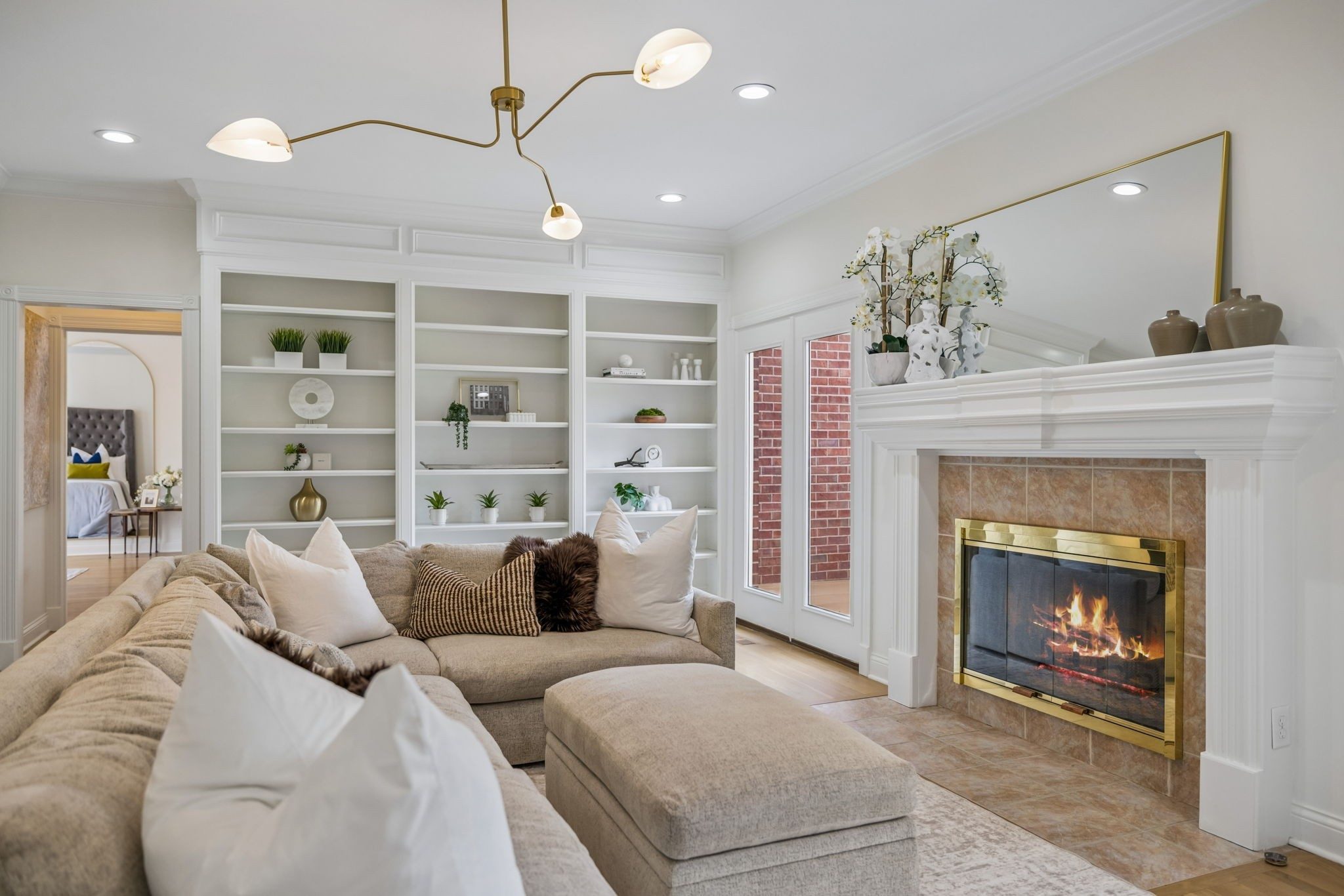 Living room with a fireplace and built in shelves at 9004 Old Smyrna Road, Brentwood TN