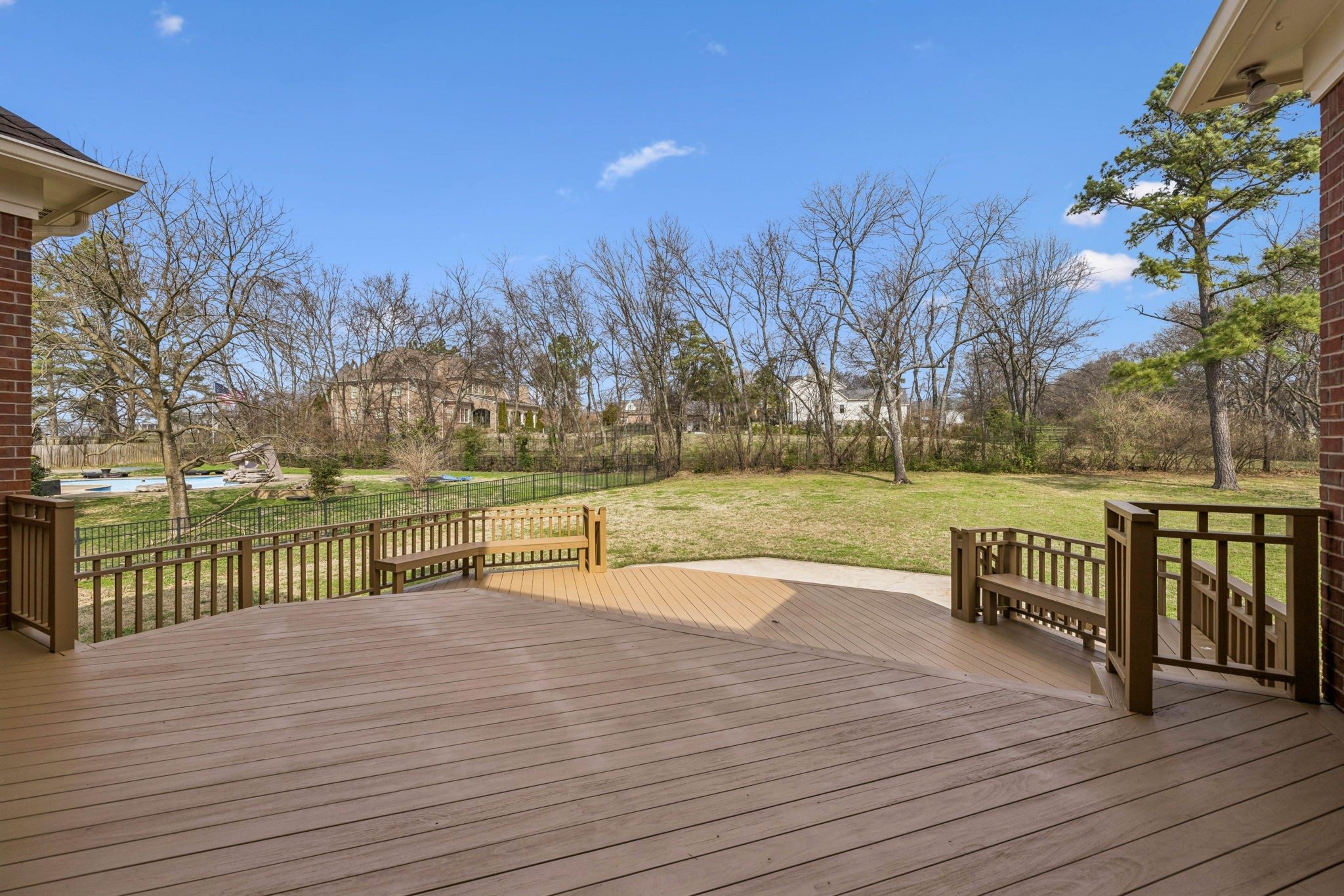 Redwood deck overlooking the flat backyard at 9004 Old Smyrna Road, Brentwood TN