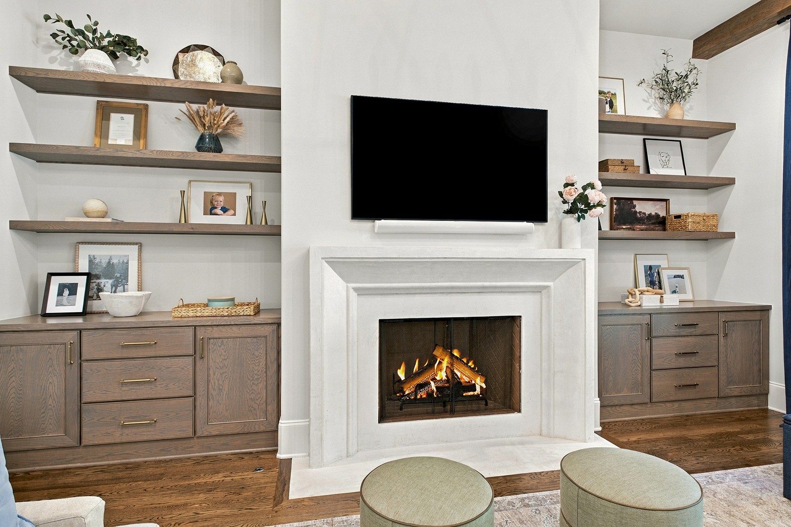 Living room with a fireplace and built in shelves at 9265 Berwyn Court, Brentwood TN
