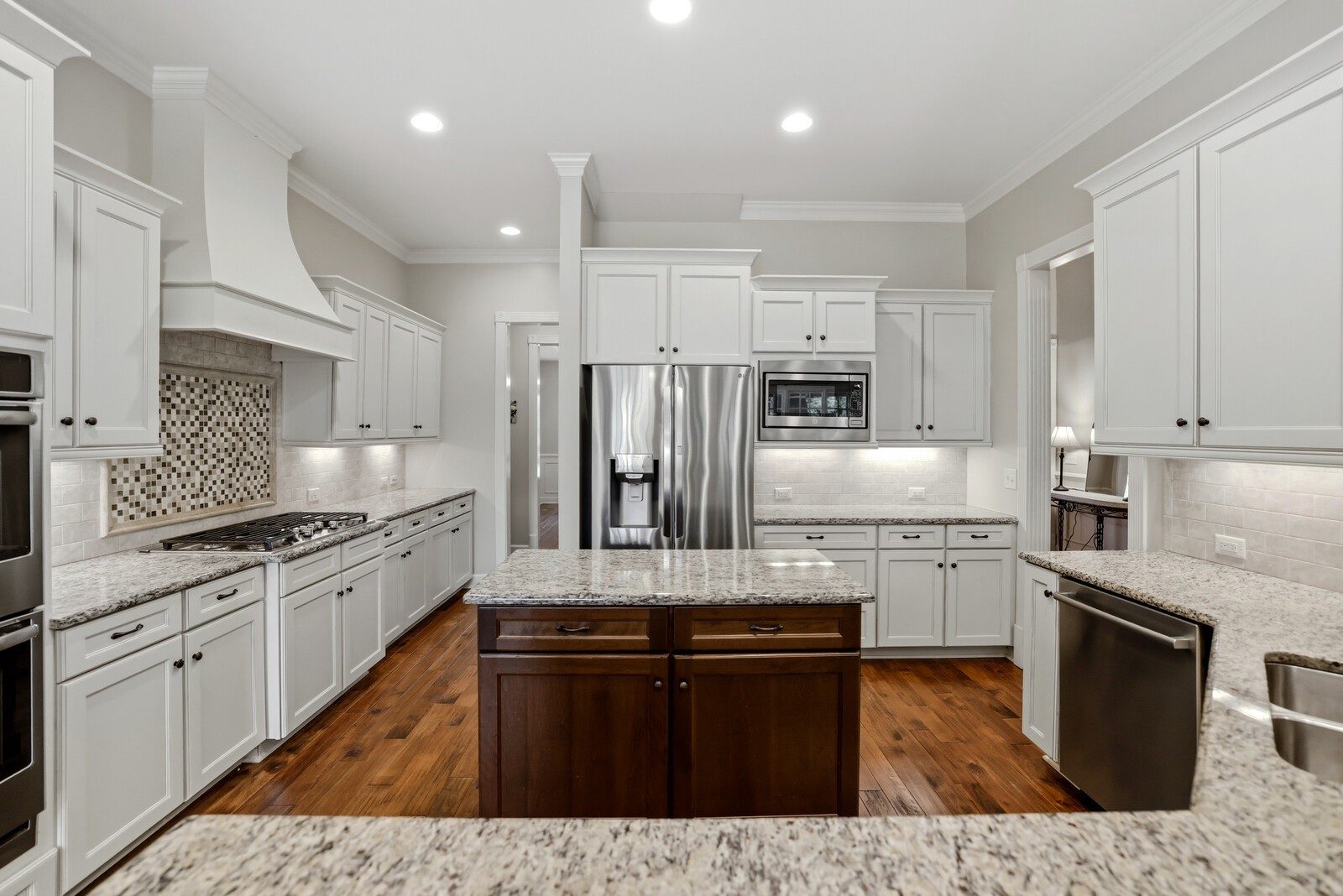 Kitchen with a large island and white cabinets at 9405 Big Horn Ridge, Brentwood TN